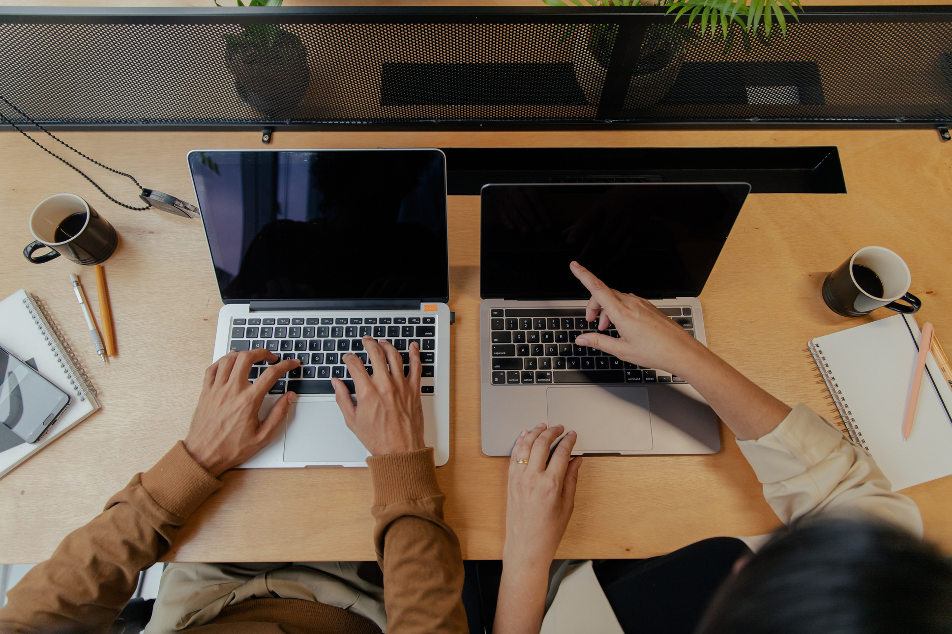 Top View of Two Business Colleagues Working on Laptops